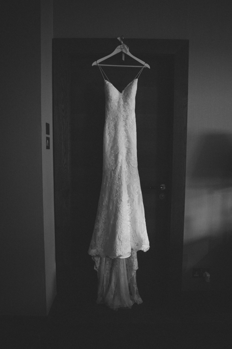 A wedding dress hanging up in the tigerlily hotel before an Edinburgh wedding