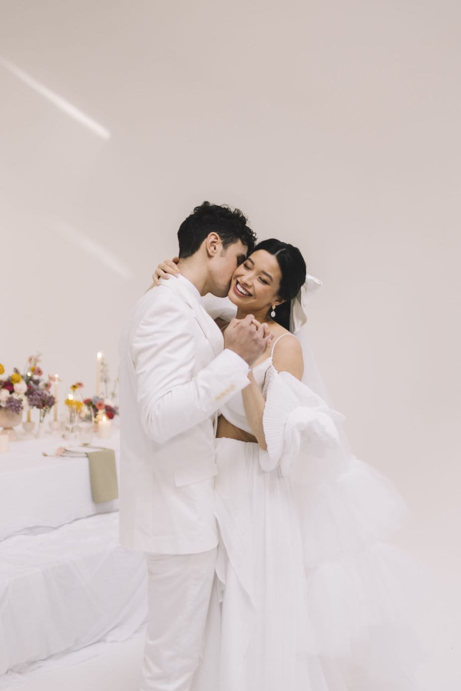 Couple embracing during wedding portraits at five four studios in Manchester.