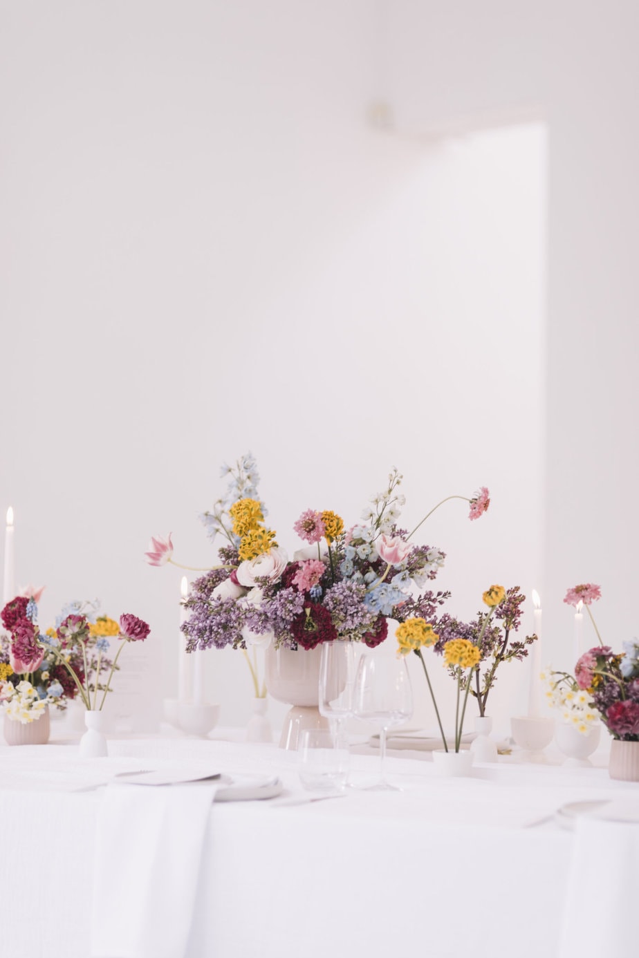 bright floral table wedding breakfast set up at five four studios manchester wedding venue